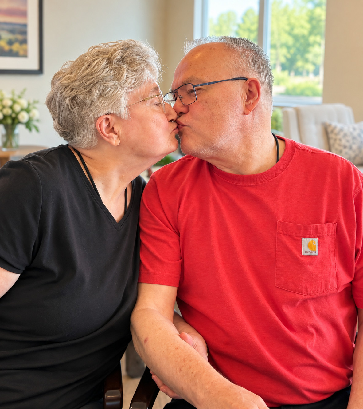 Elderly couple sharing a loving kiss at Bella Largo Senior Living.
