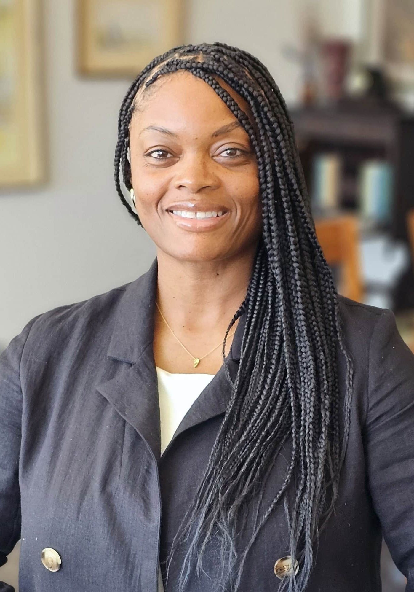 Senior living community staff member smiling confidently.